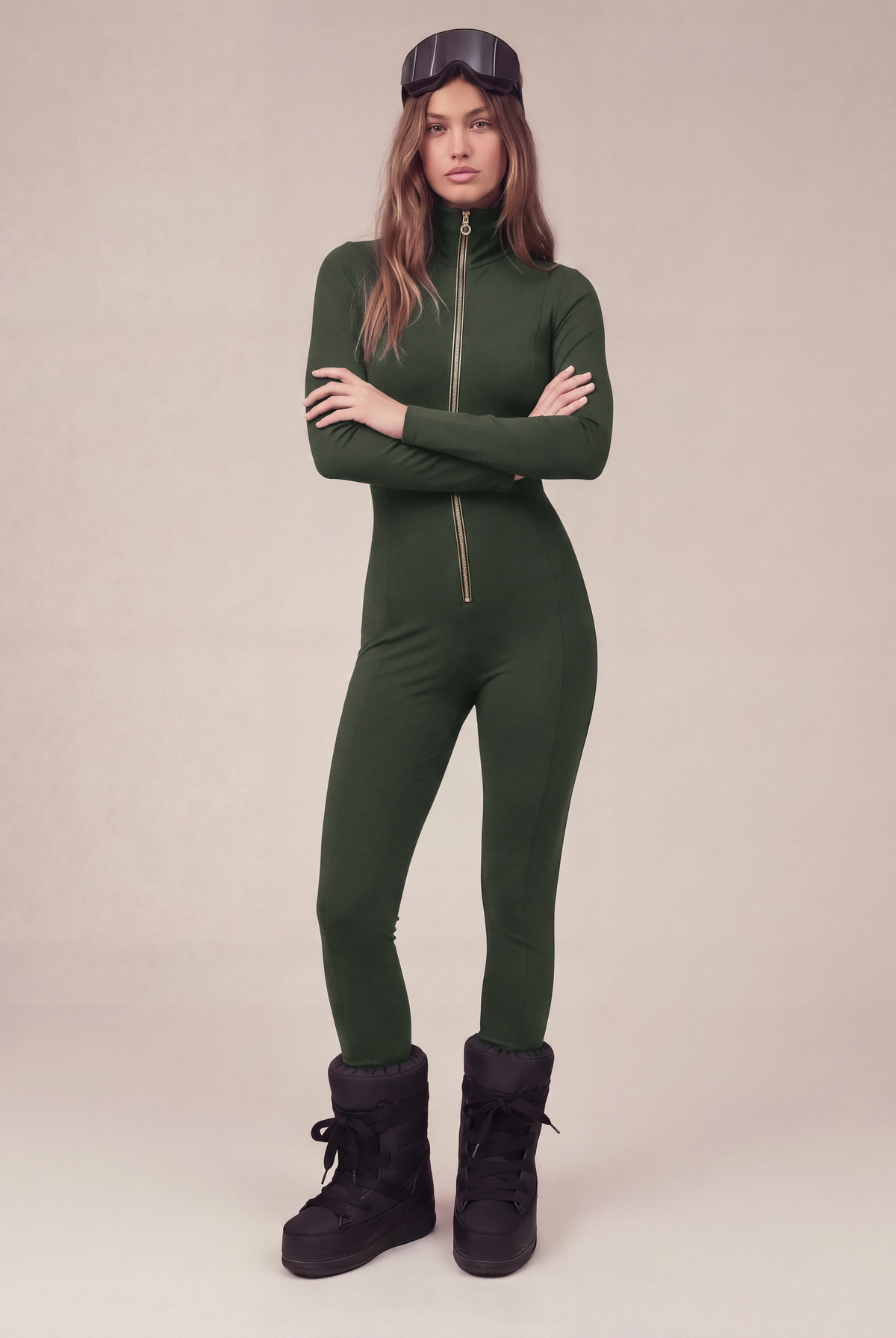 Skynwear Base Layer Jumpsuit in khaki, arms crossed