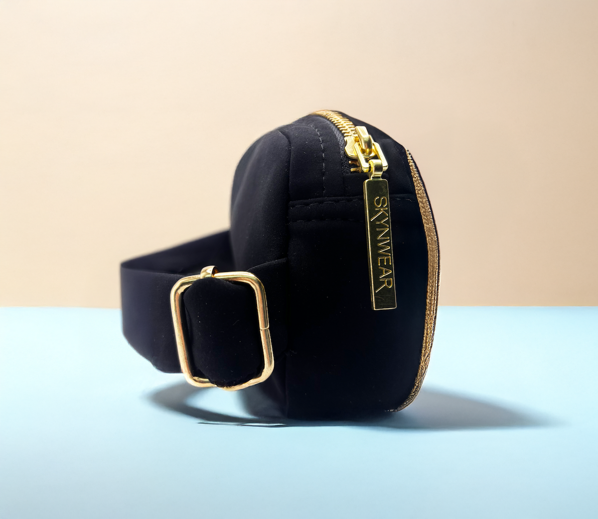 Skynwear soft-shell waist bag with gold zip