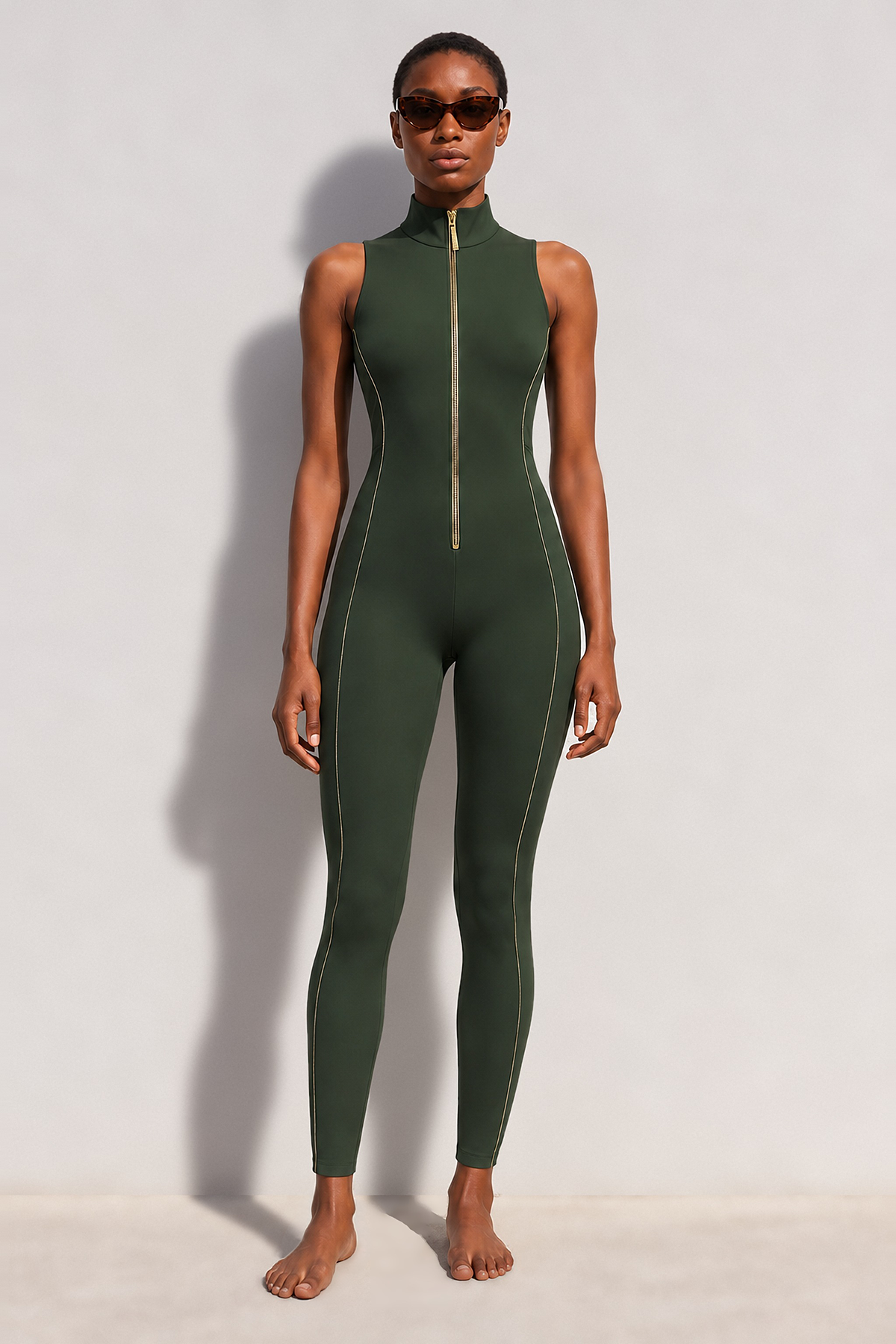 Apex Jumpsuit in khaki, front view with gold zip and piping